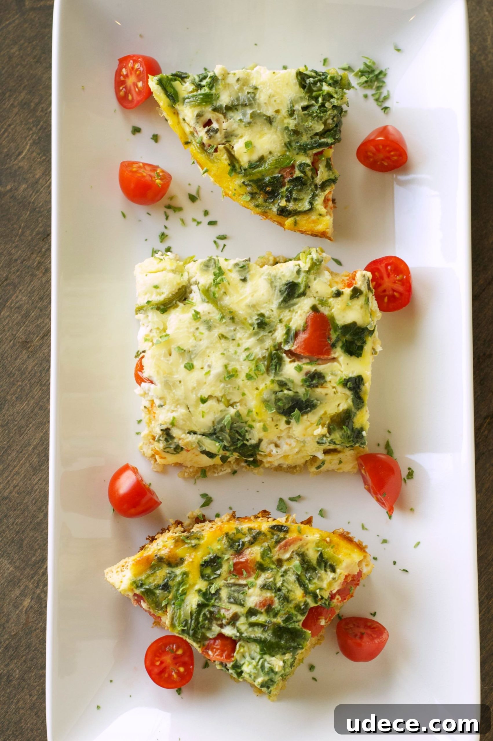 top view of 3 pieces of breakfast casserole on white plate 