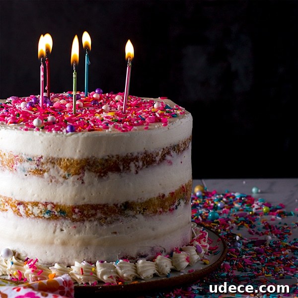 All-Butter Funfetti Cake & Cupcakes Recipe 7 Funfetti Cake with Classic American Buttercream topped with lit birthday candles.