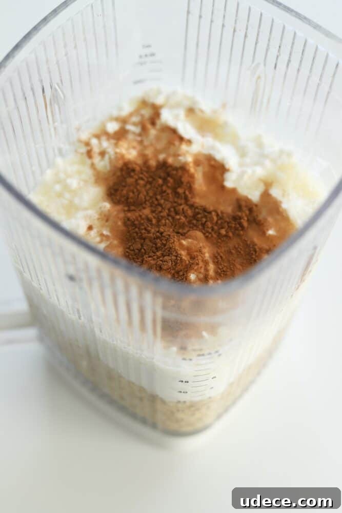 High-Protein Cottage Cheese Pancakes Recipe 4 a blender full of cottage cheese protein pancake batter.