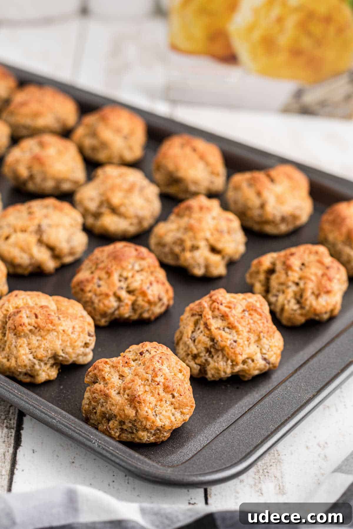 Cheddar Bay-Style Sausage Balls Recipe for Parties and Snacks 6 Side shot of a baking sheet with cheddar bay sausage balls.