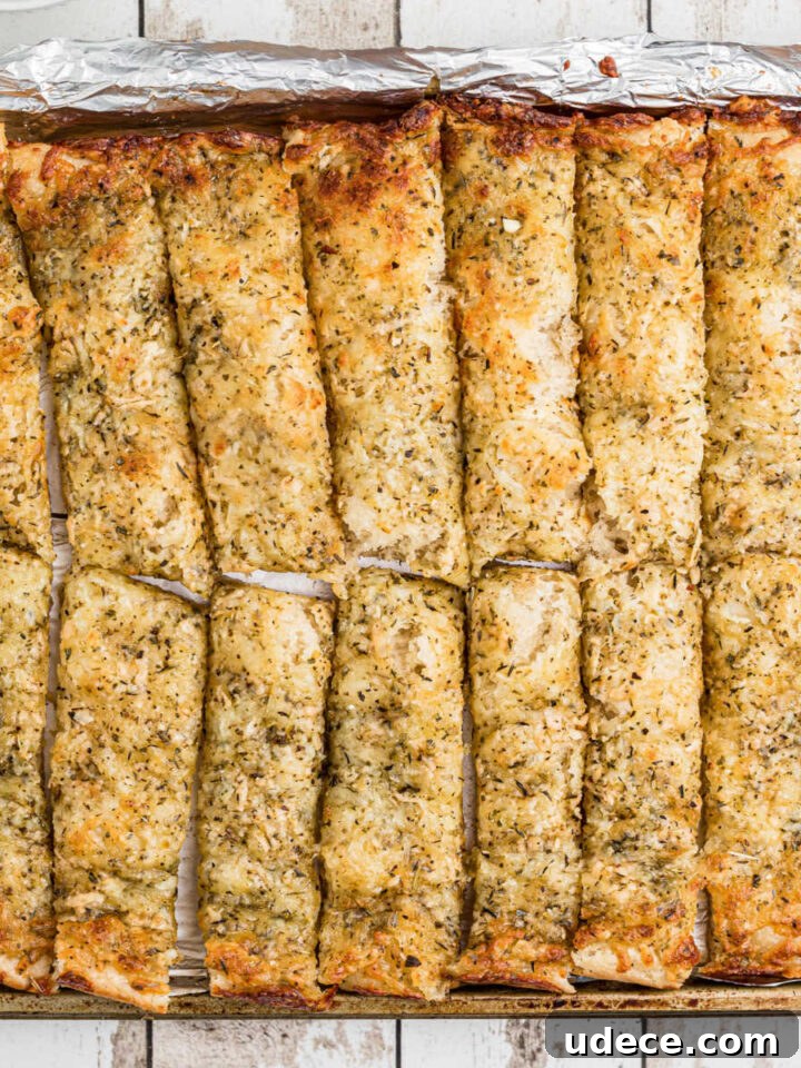 An overhead shot of a pan full of little caesars italian cheese bread recipe.