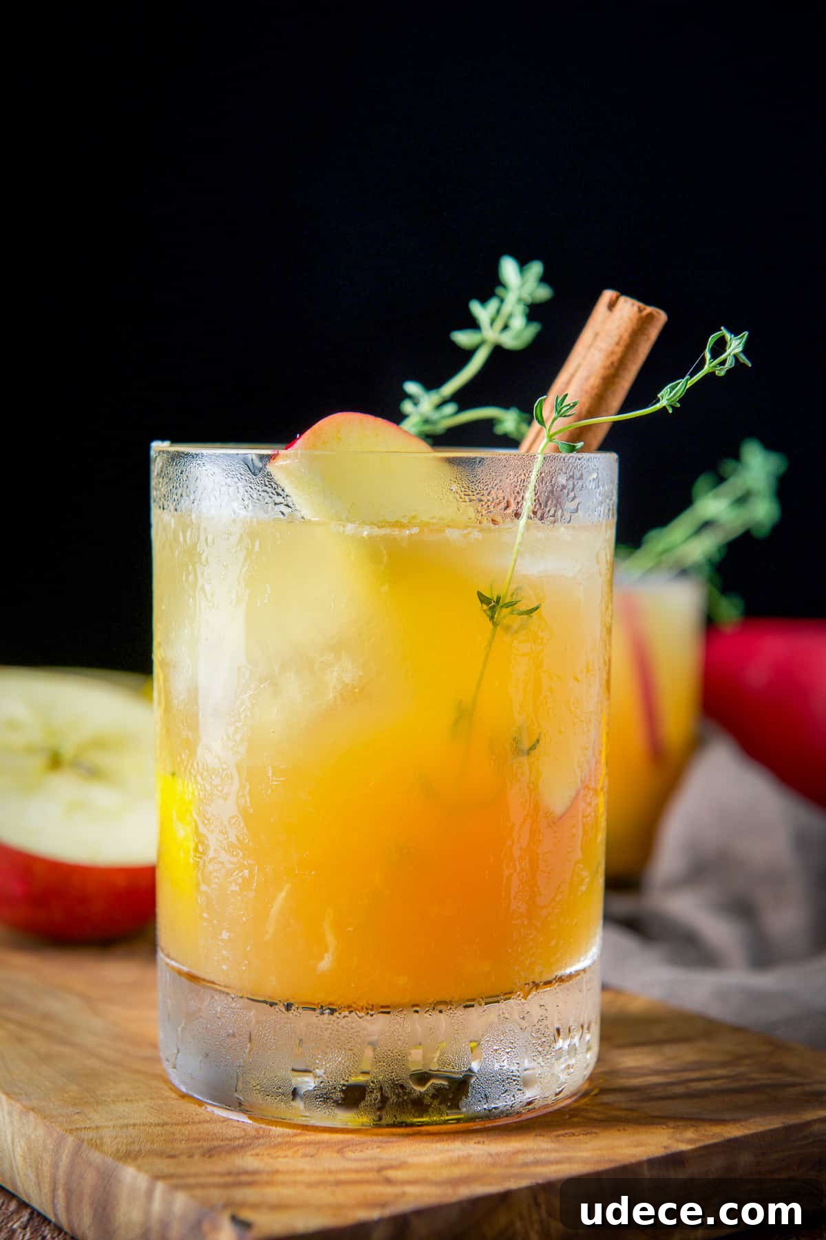Apple Cider Bourbon Smash Cocktail Recipe 10 Double old fashioned glass filled with the lemon, apple cider and bourbon, with apple, cinnamon and thyme as garnish