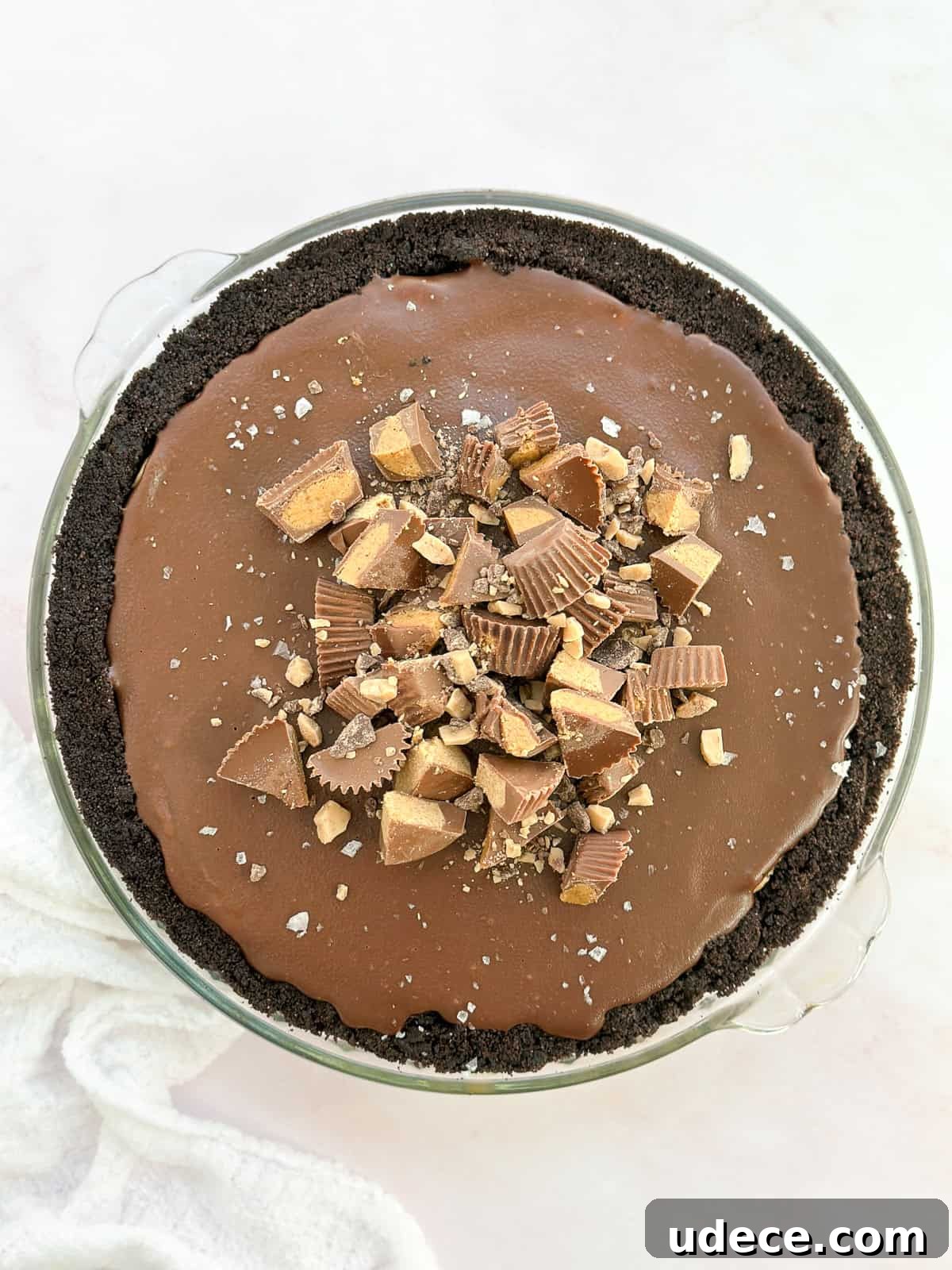 Decadent Peanut Butter Pie with Chocolate Ganache Recipe 11 the peanut butter pie with chocolate ganache topped with extra peanut butter cups, toffee bits and salt.