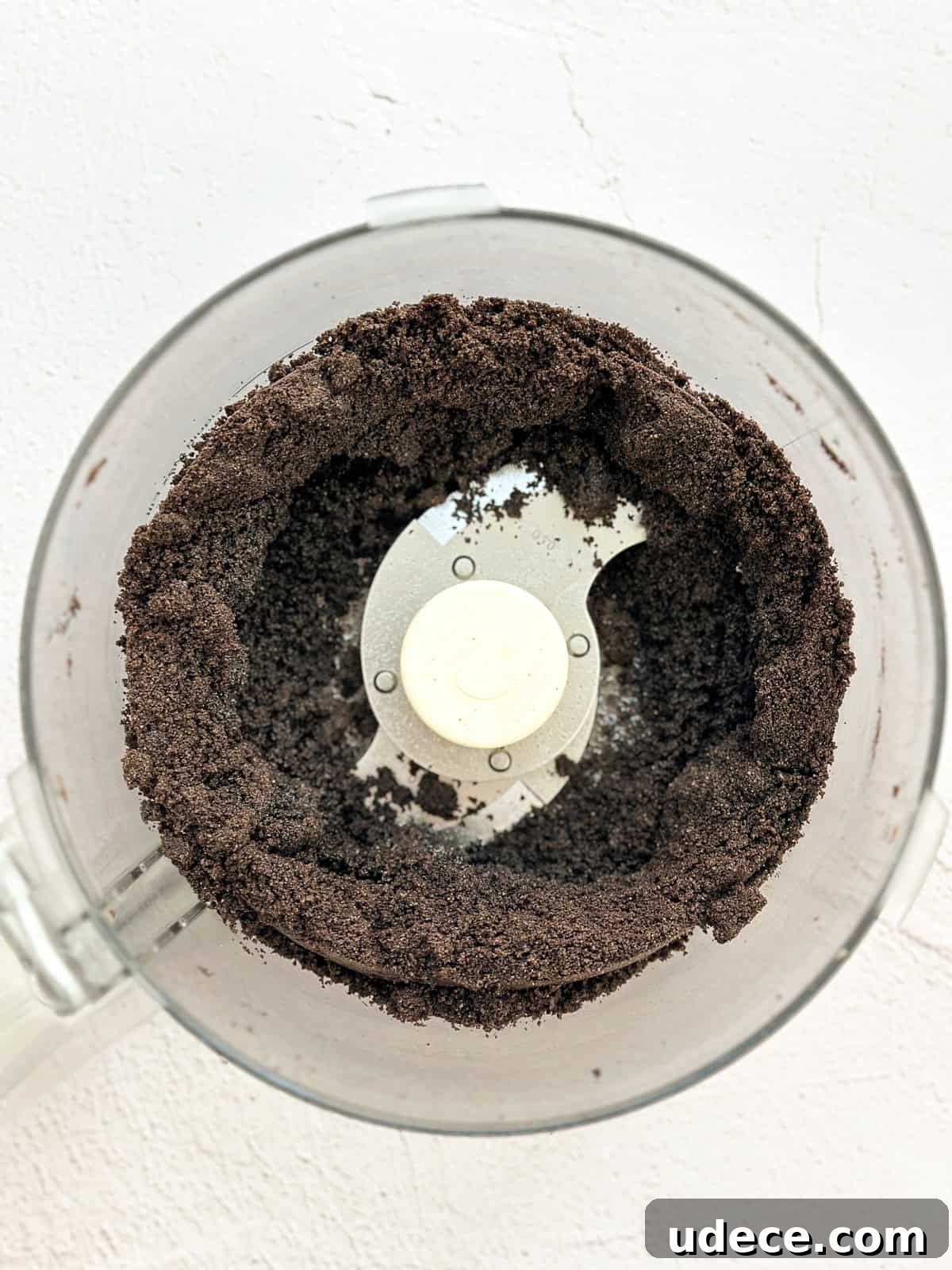 Decadent Peanut Butter Pie with Chocolate Ganache Recipe 4 oreos and butter mixed in a food processor.