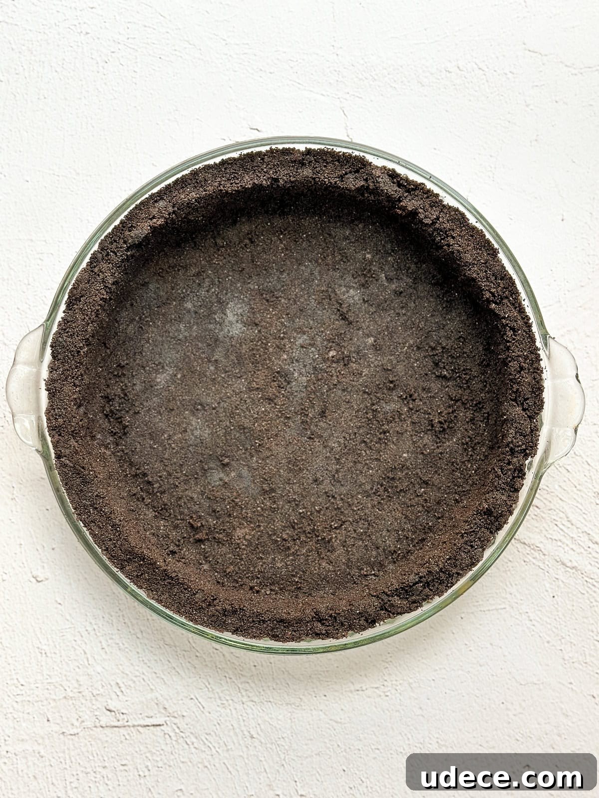Decadent Peanut Butter Pie with Chocolate Ganache Recipe 5 oreo crust baked in a pie plate.
