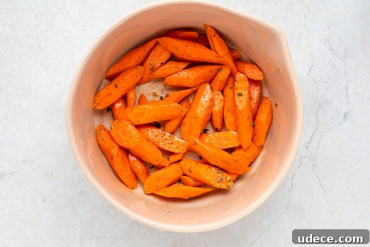 Sliced carrots in a large bowl.