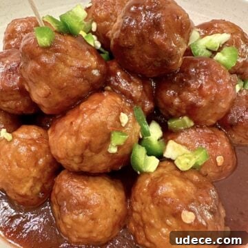 Sweet and Spicy Cranberry Jalapeño Meatballs Recipe 13 Meatballs in a serving bowl.