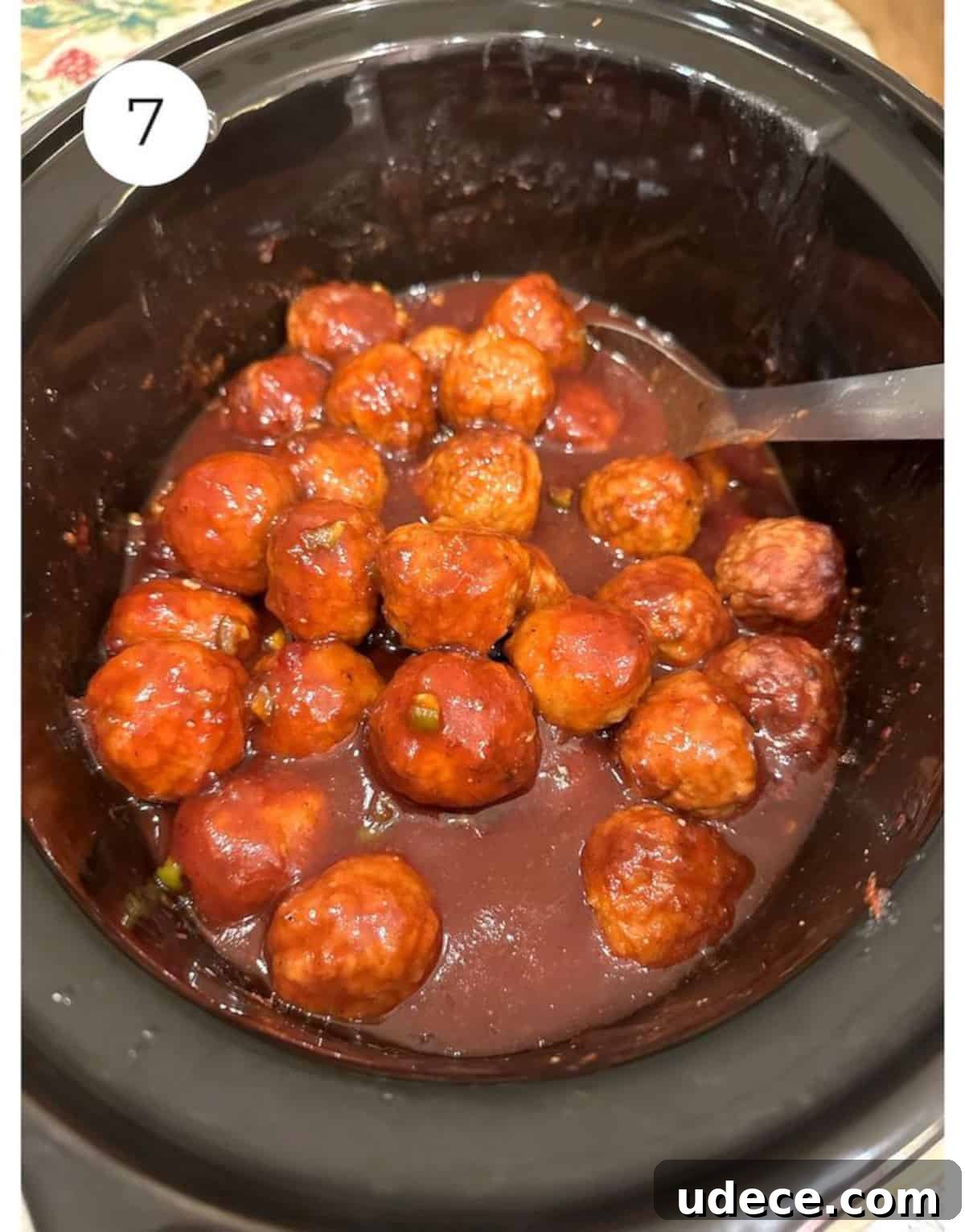 Sweet and Spicy Cranberry Jalapeño Meatballs Recipe 7 Meatballs and sauce in a slow cooker.