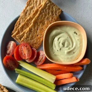 Creamy Avocado and Cottage Cheese Dip Recipe for Snacks 11 Avocado cottage cheese dip served with veggies and crackers.