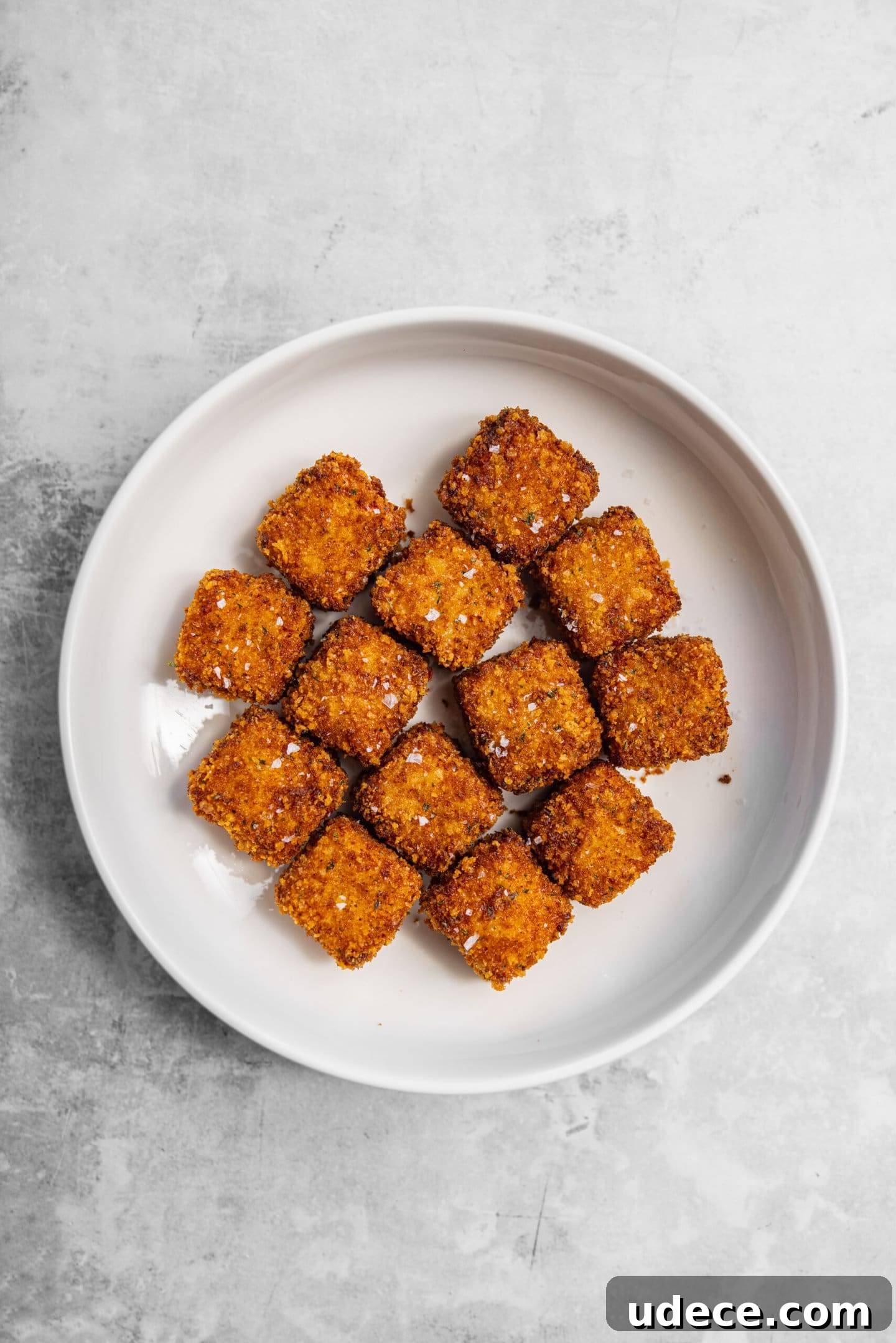 Crispy Homemade Mac and Cheese Bites: Bite-Sized Comfort Food 12 Freshly fried mac and cheese bites with flaky salt on top