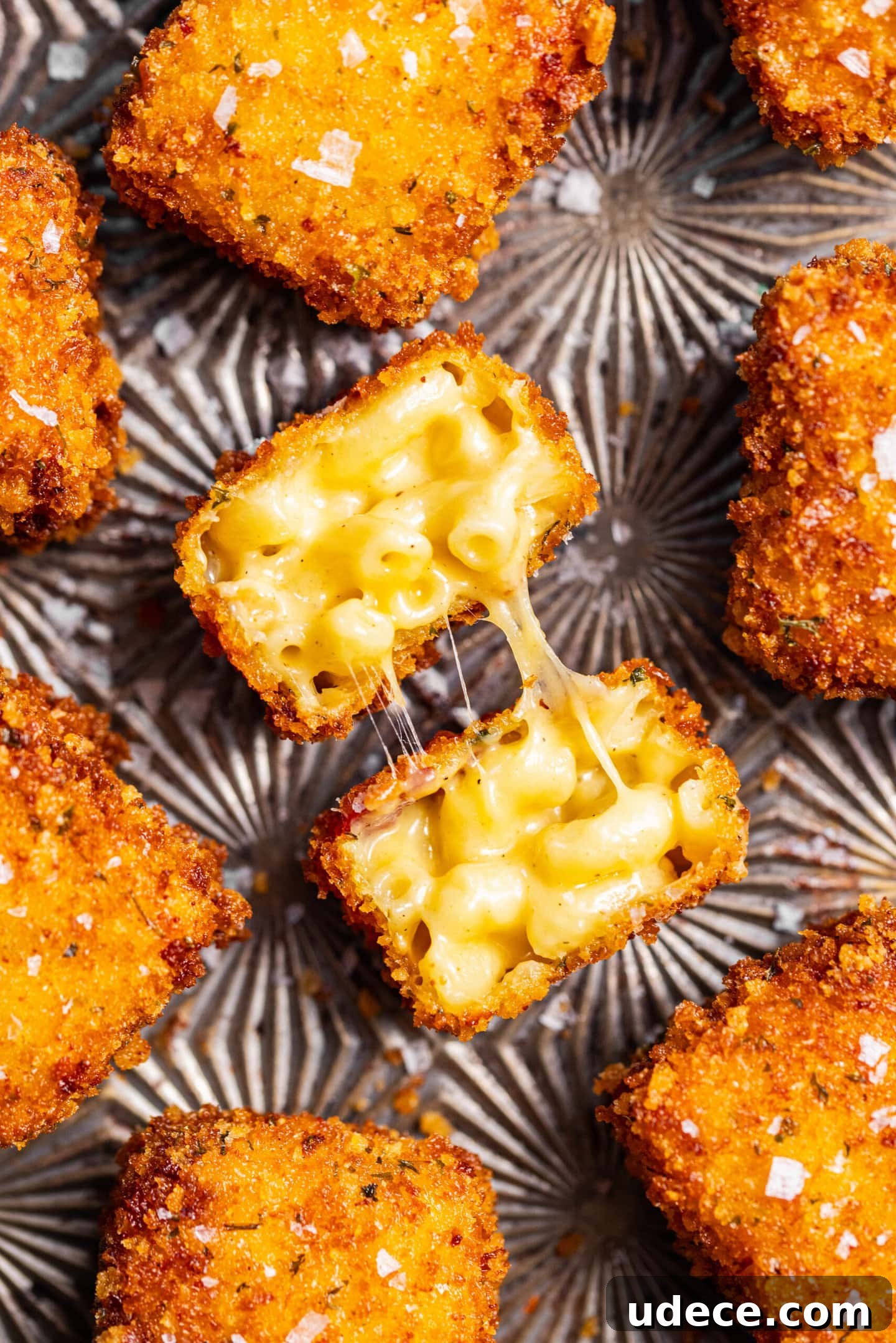 Crispy Homemade Mac and Cheese Bites: Bite-Sized Comfort Food 3 Crispy Fried Homemade Mac and Cheese Bites with cheese pull