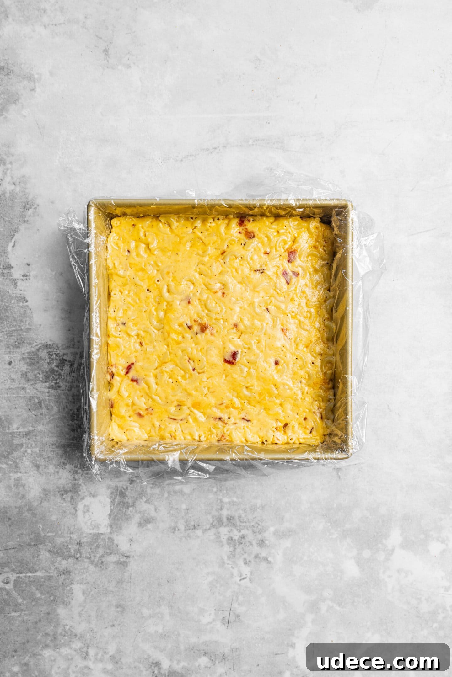 Crispy Homemade Mac and Cheese Bites: Bite-Sized Comfort Food 8 bacon mac and cheese smoothed into an even layer in baking pan.