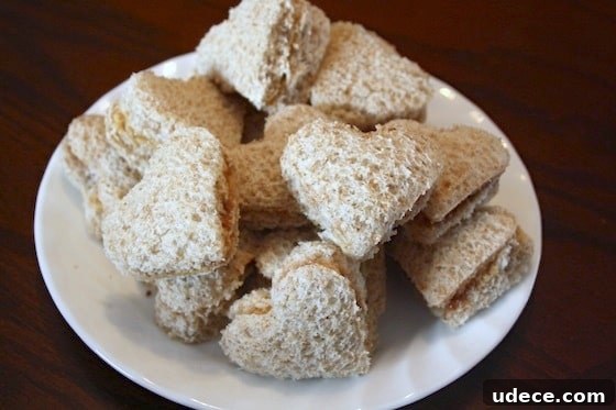 Valentine’s Day Lunch Ideas Kids Will Love 3 bite-size heart-shaped peanut butter and jam sandwiches