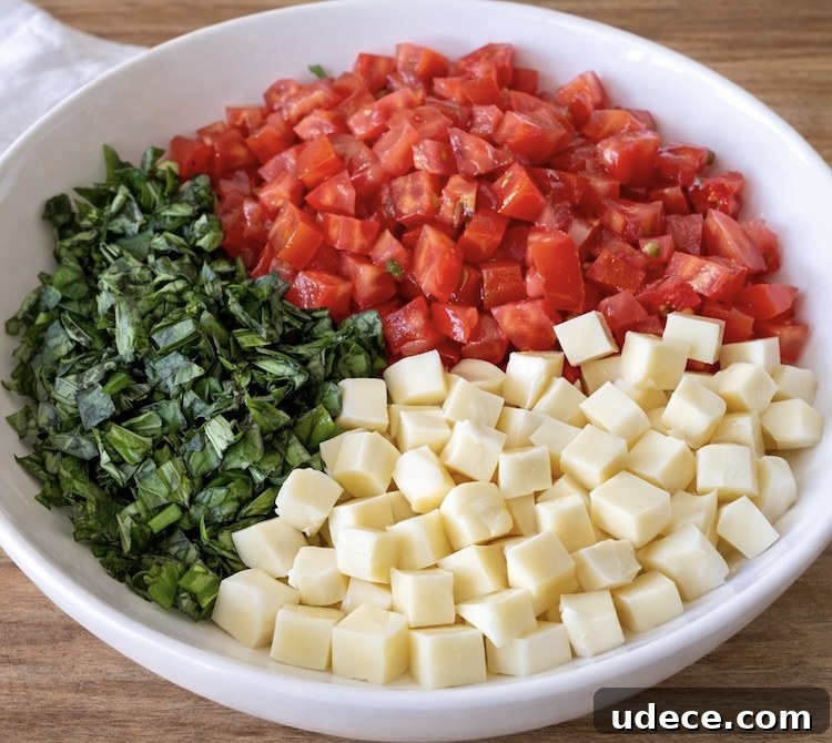 Chopped Caprese Toast: Fresh Tomato, Basil & Mozzarella Recipe 4 Step 1 How To make Caprese Toast: Chopped mozzarella, tomatoes, and fresh basil in a bowl.