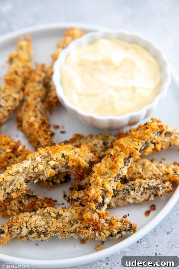 baked portobello mushrooms side view of a serving of baked Portobello Mushroom Fries served with aioli