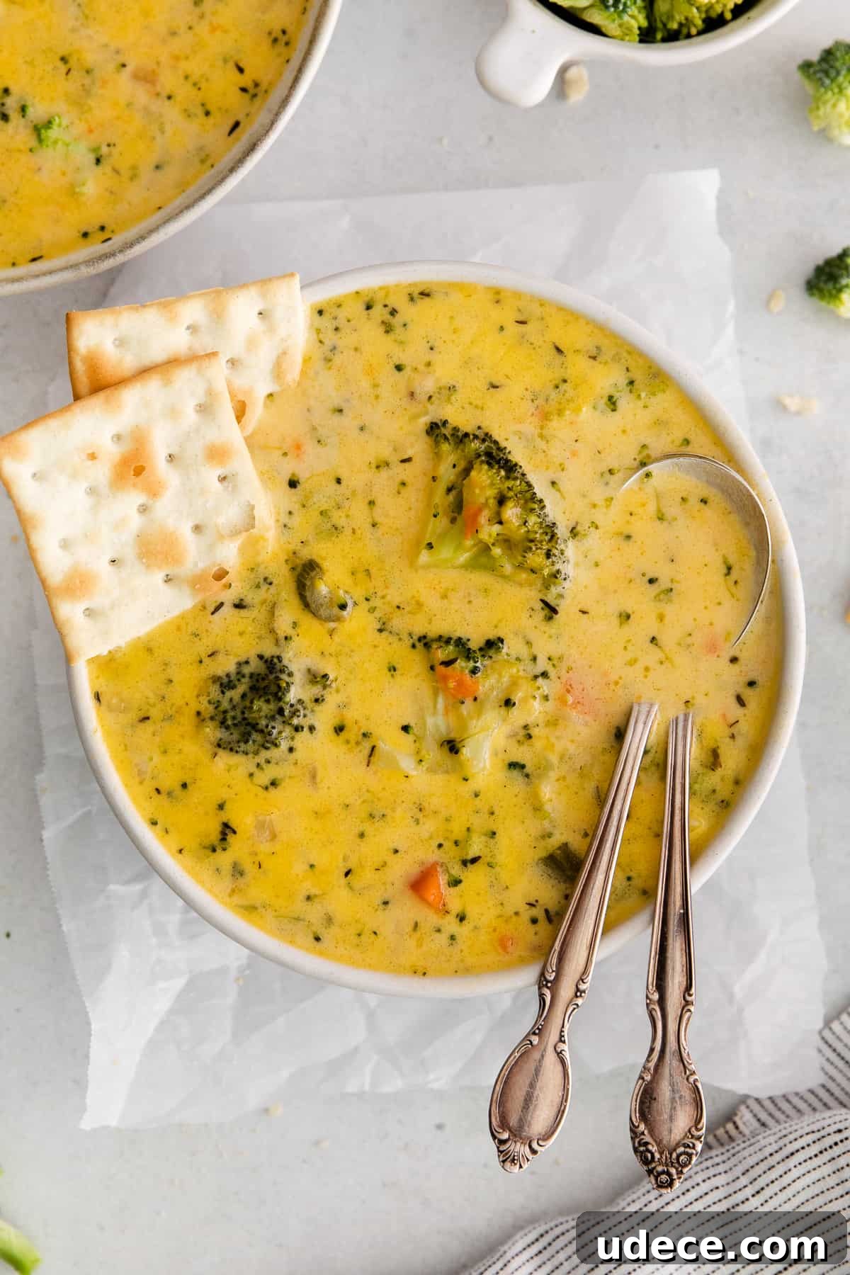 Creamy Broccoli, Potato & Cheddar Soup Recipe 2 Broccoli potato cheese soup with crackers on the side.