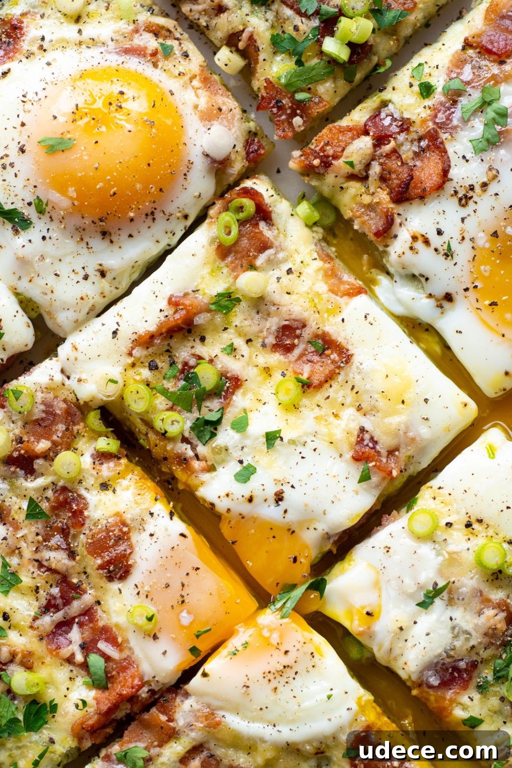 5-Ingredient Breakfast Pizza with Pesto and Crispy Bacon 10 Close up shot of cooked and sliced breakfast pizza.
