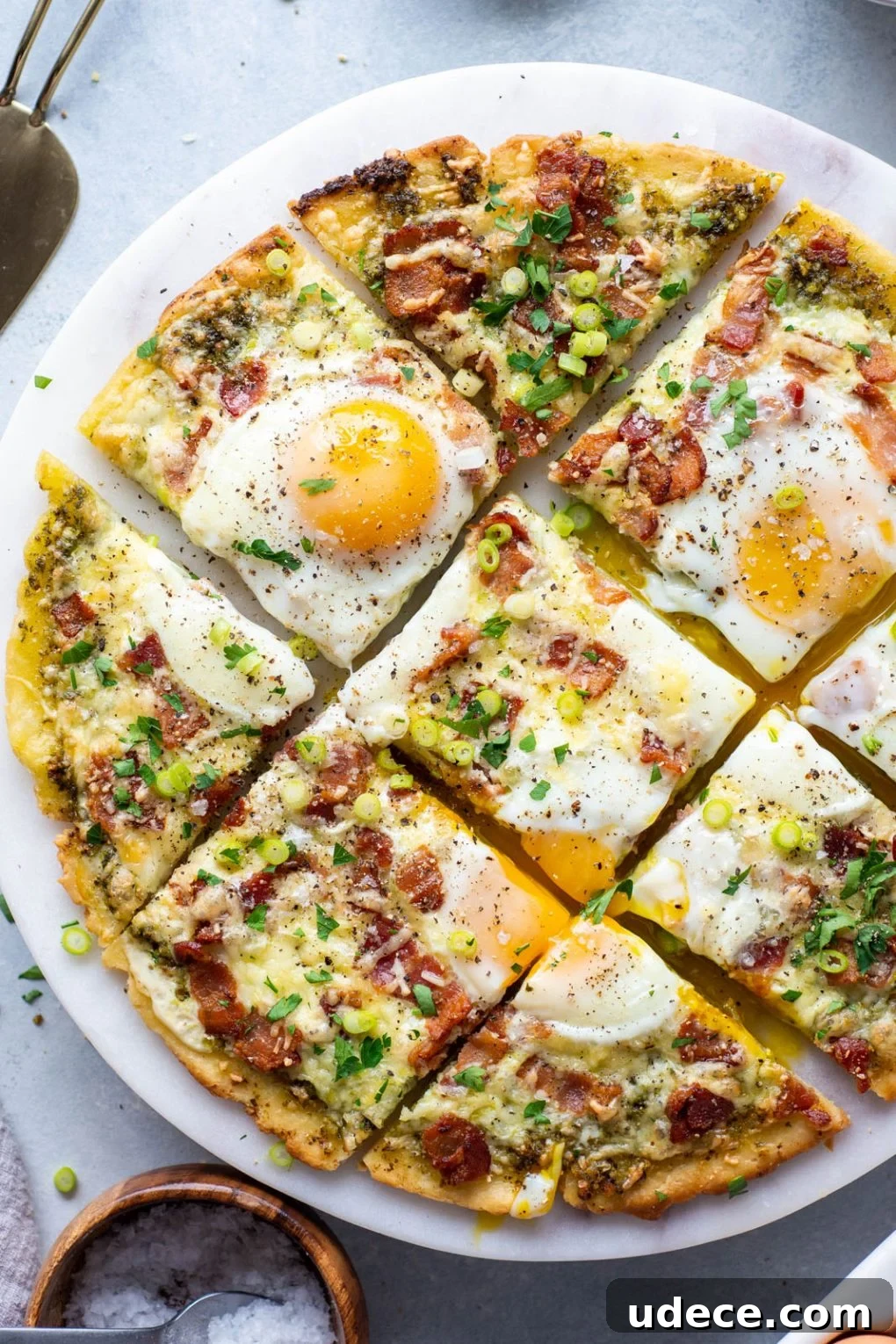 5-Ingredient Breakfast Pizza with Pesto and Crispy Bacon 11 Finished breakfast pizza on a serving tray.