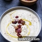 A delicious creamy low carb cauliflower soup that is not only good for you but cooked in under 30 minutes! Full of good for you fats and low on the carbs this soup will not only satisfy your soup cravings but will make you feel like you are indulging!