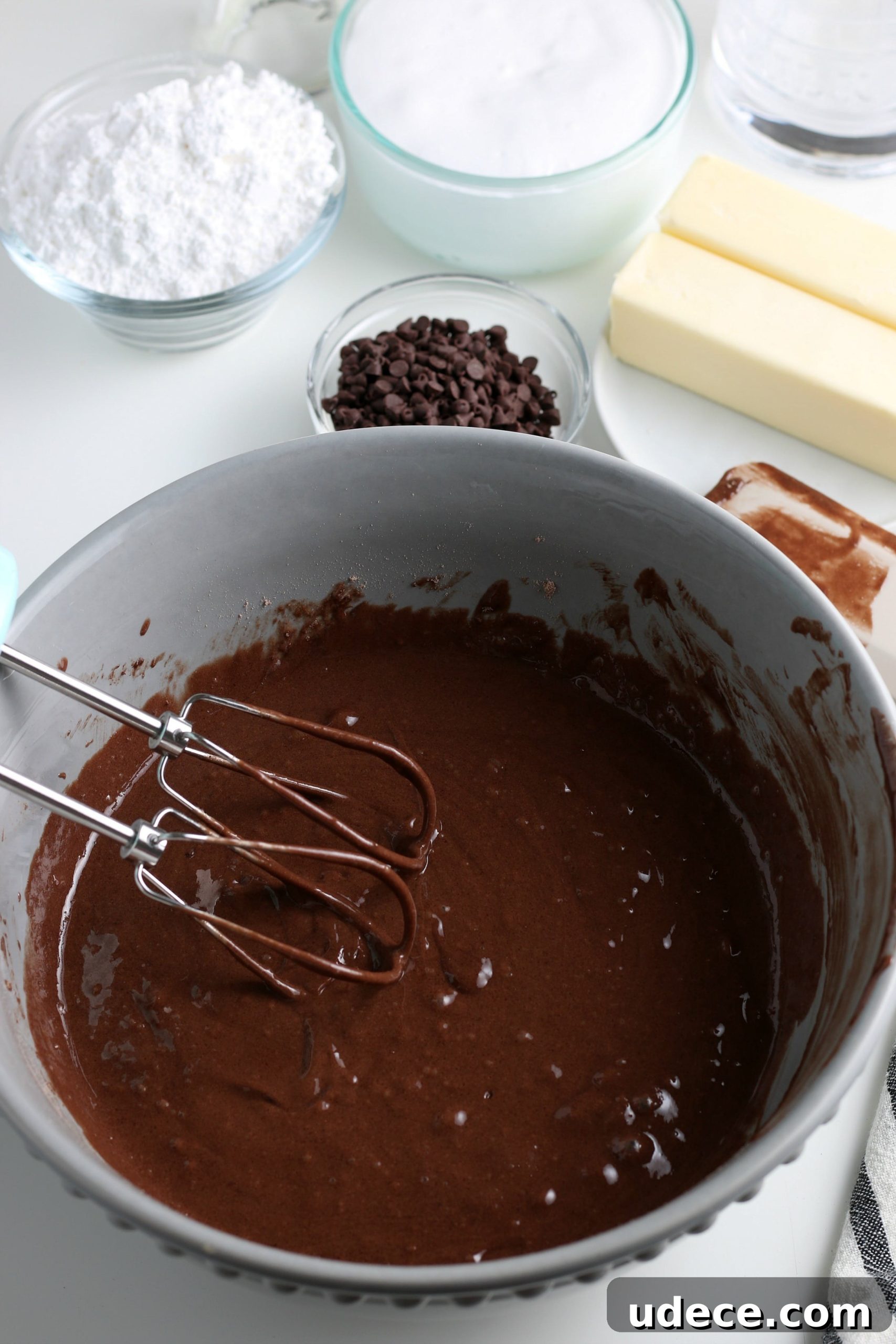 S’mores Cupcakes from Cake Mix: Quick Campfire Dessert Recipe 6 whisking chocolate cupcake batter in a bowl