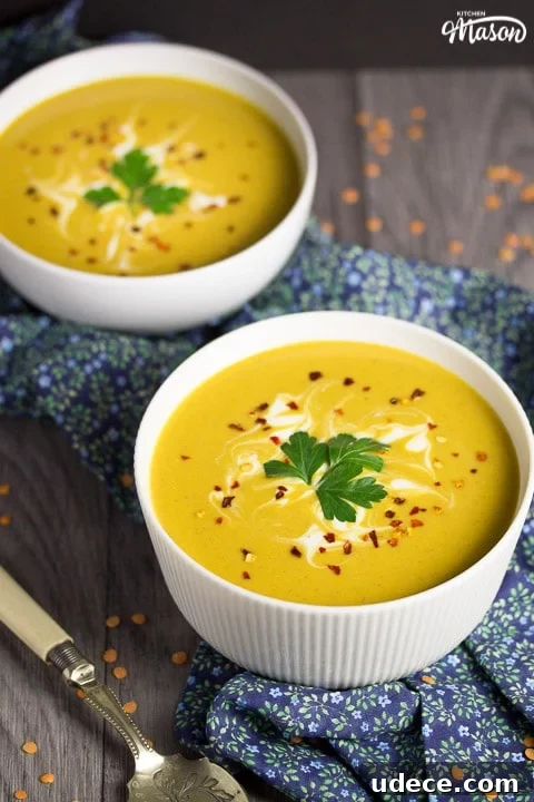 Curried Coconut Lentil Soup with Warm Spices Recipe 7 curried coconut lentil soup in a bowl with parsley and chilli flakes on top