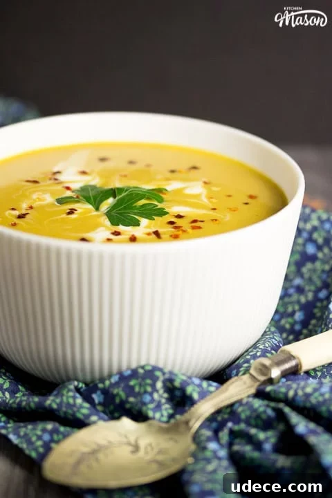Curried Coconut Lentil Soup with Warm Spices Recipe 4 curried coconut lentil soup in a bowl with parsley and chilli flakes on top
