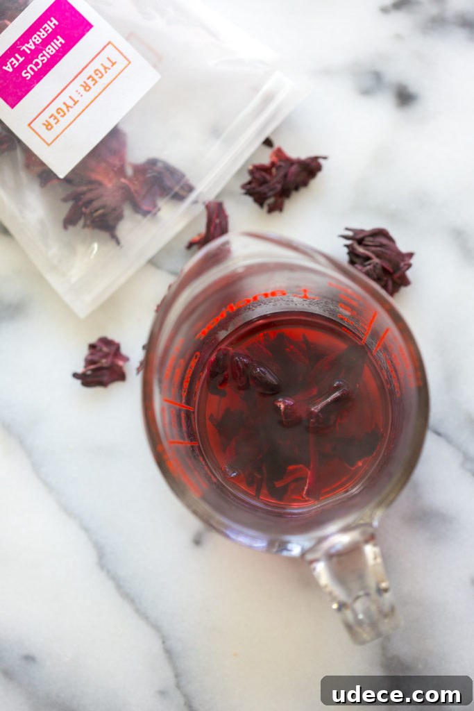 Hibiscus-Glazed Shortbread Cookies: Floral Tea Cookie Recipe 11 Hibiscus tea steeping for cookie glaze