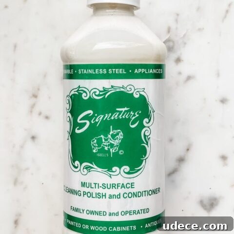 bottle of signature polish on a white marble board