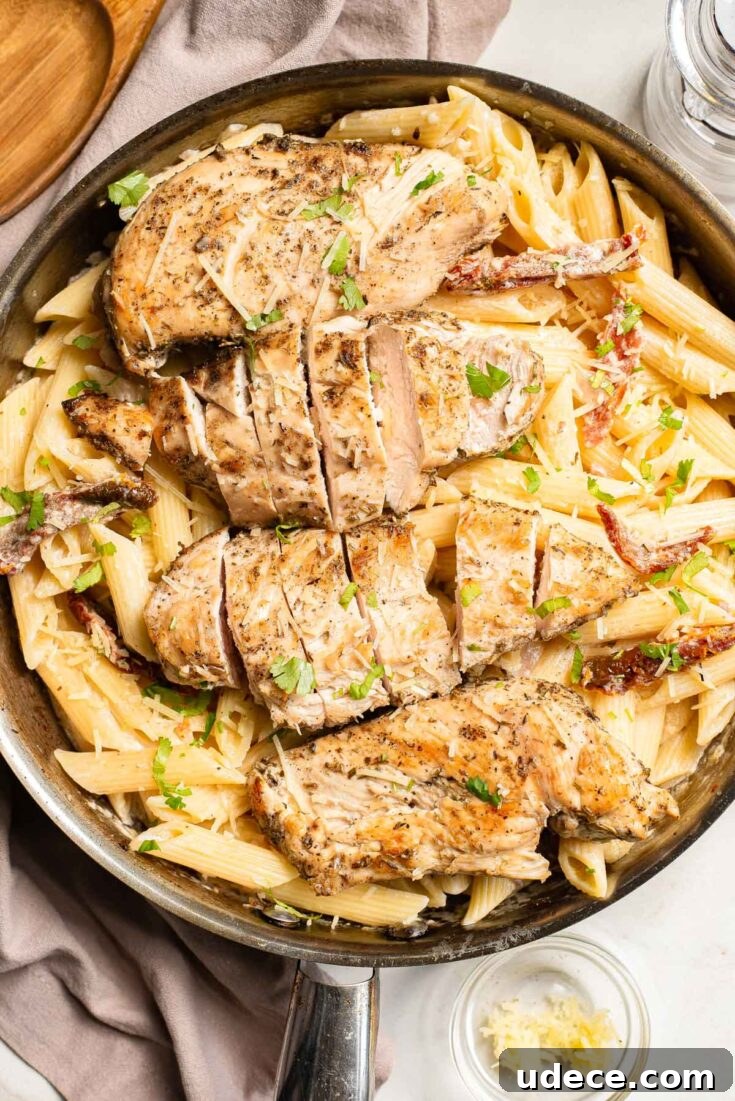 Garlic parmesan chicken pasta in a skillet.