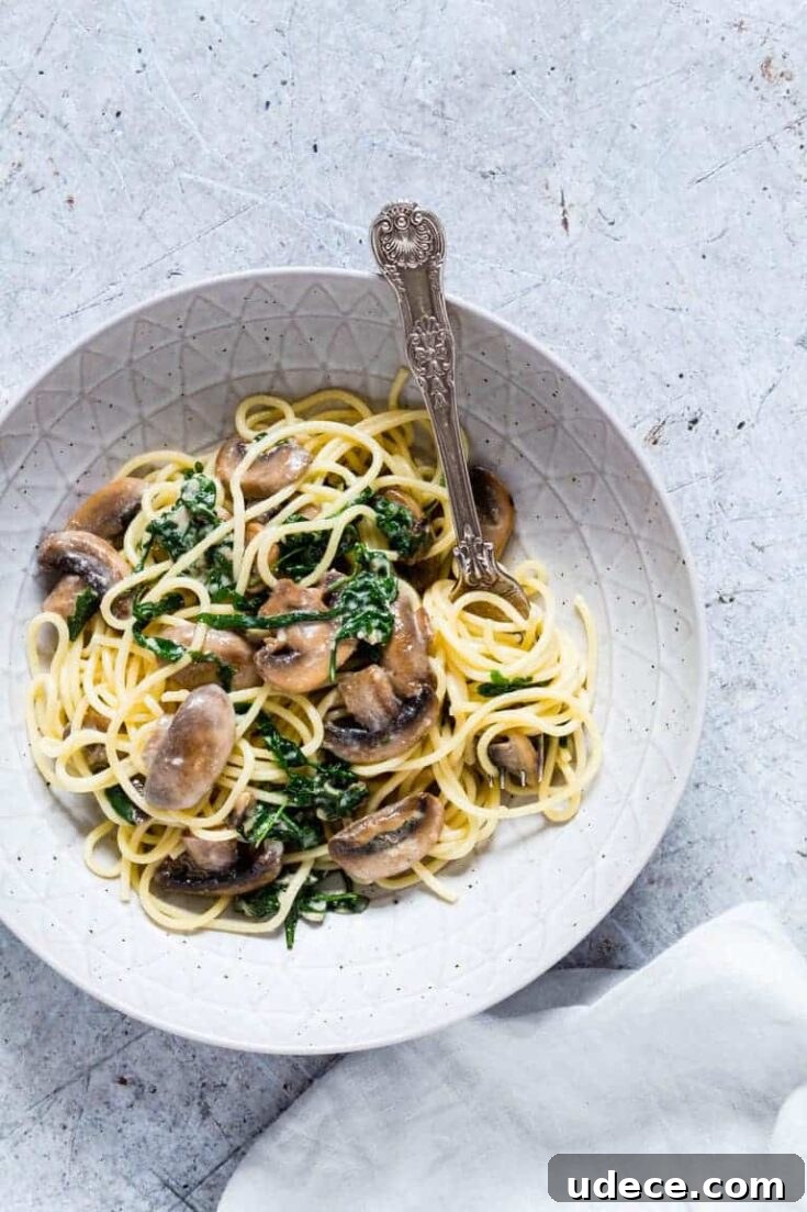 Creamy orange mushroom pasta with rocket and parmesan