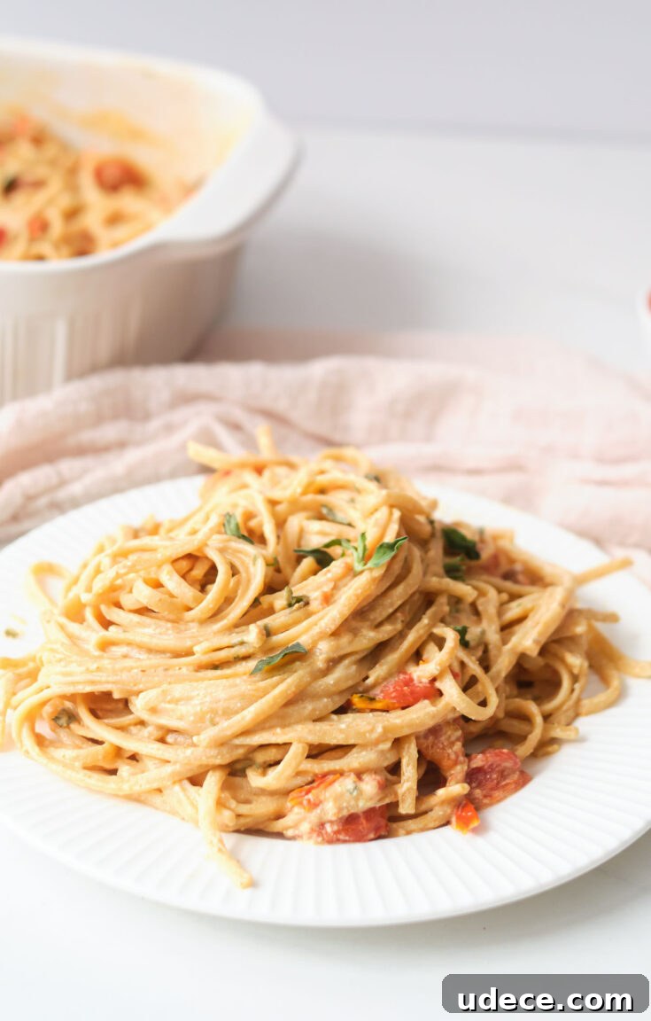 The completed Boursin cheese pasta served on a white plate.