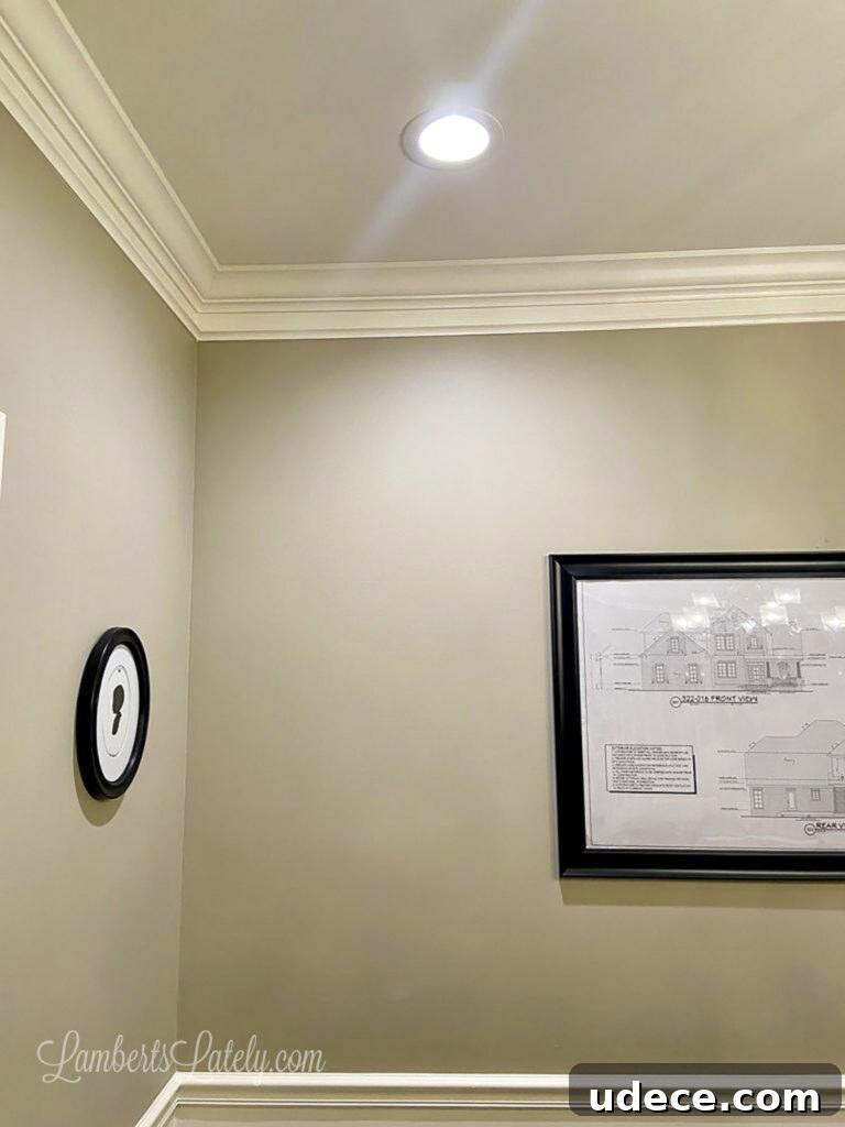DIY Faux Crown Molding Guide: Simple Beginner-Friendly Hack 2 after shot of diy thick faux crown molding in a dining room.