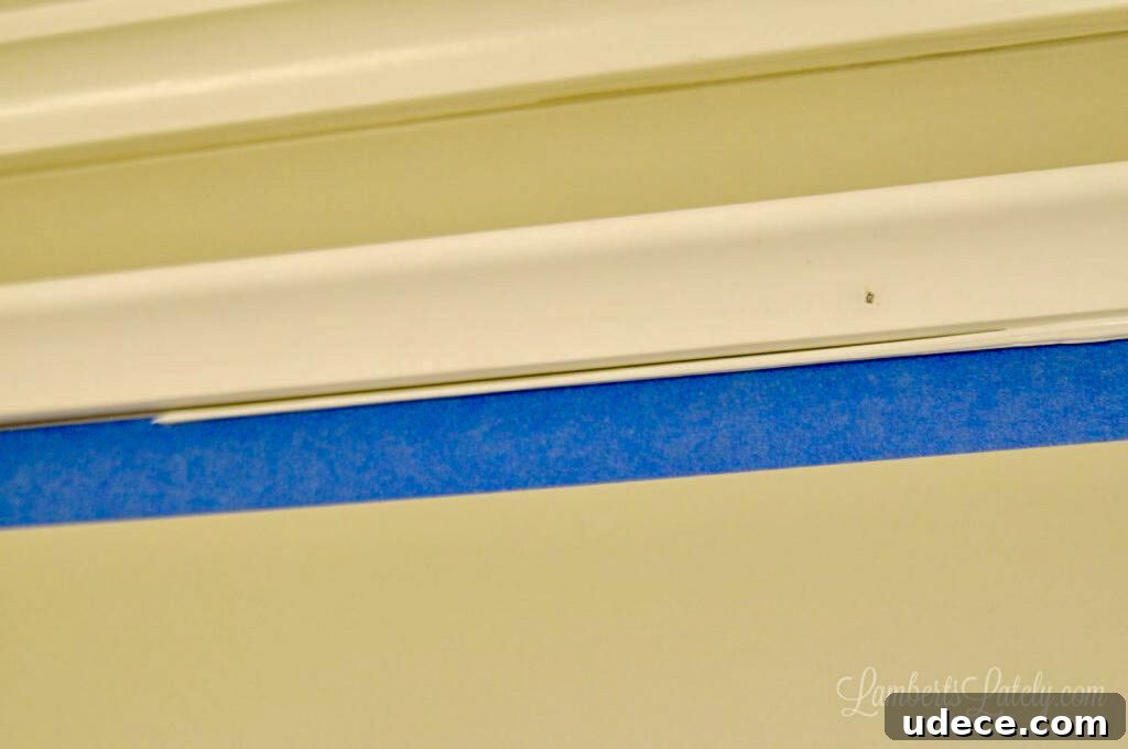 DIY Faux Crown Molding Guide: Simple Beginner-Friendly Hack 11 small bead of caulk below crown molding piece.