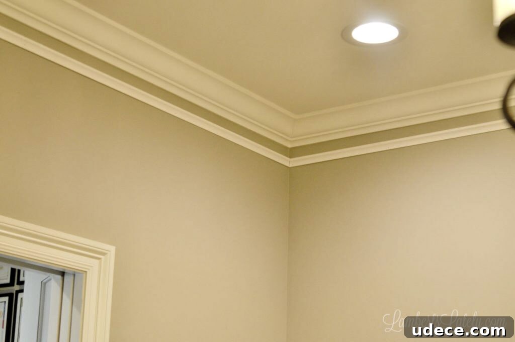 DIY Faux Crown Molding Guide: Simple Beginner-Friendly Hack 8 molding installed below original crown molding.