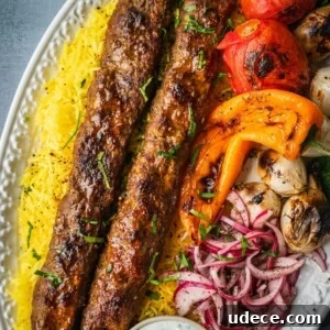 4 Mediterranean Meal Plans for Seasonal August Eating 12 A platter with saffron rice, grilled koobideh kebabs, grilled vegetables and sumac onions.