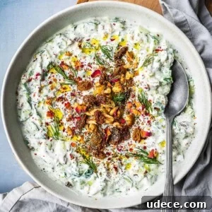 4 Mediterranean Meal Plans for Seasonal August Eating 13 Bowl of mast-o khiar dip, garnished with rose petals, nuts, raisins and herbs.
