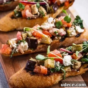 4 Mediterranean Meal Plans for Seasonal August Eating 4 Toasted sliced baguette with eggplant and tomato topping.