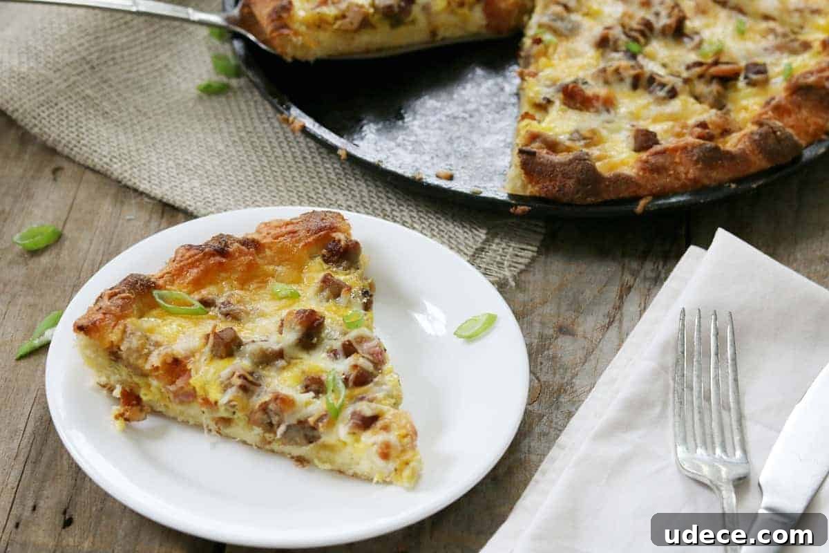 Homemade Bacon and Cheddar Breakfast Pizza Recipe 2 a slice of pizza on cutting board.