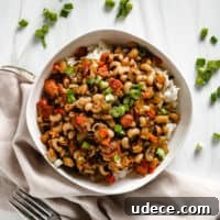 Classic Hoppin' John Recipe: Southern New Year Black-Eyed Peas 5 Top down view of hoppin john with green onions.