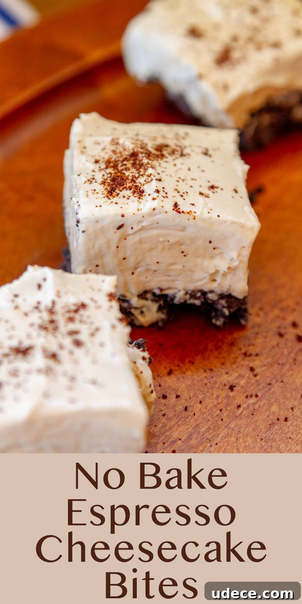 three No Bake Espresso Cheesecake Bites on a wooden serving plate with a blue and white striped cloth behind them.