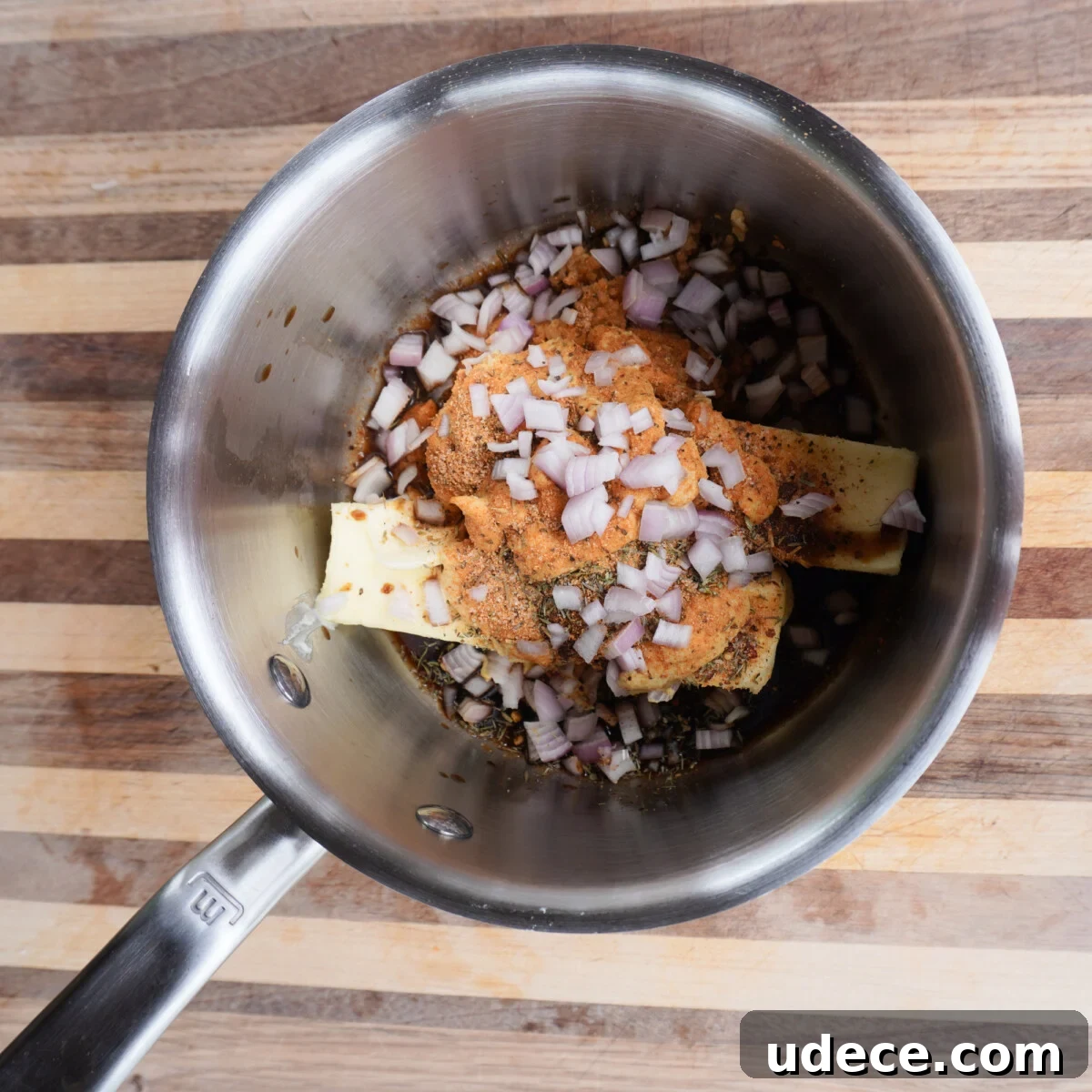 cowboy sauce ingredients in a sauce pan.