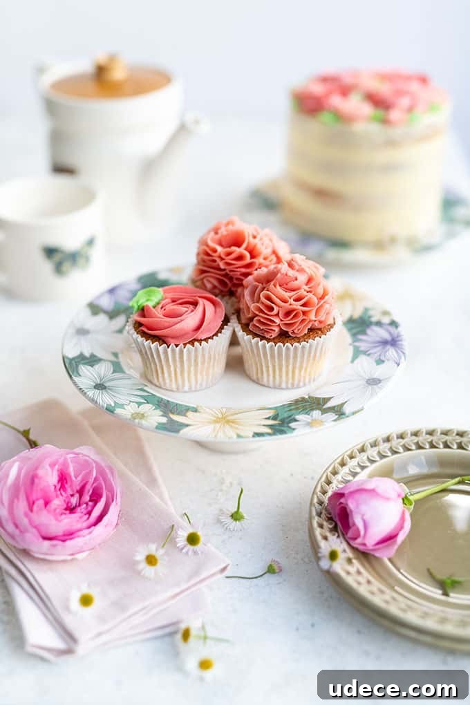 Pink Ombre Cake with Vanilla Buttercream Frosting for Parties 4 Cupcakes frosted with easiest Swiss buttercream on a cake stand
