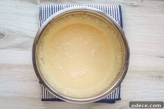 Crème Anglaise: Classic French Vanilla Custard Sauce Recipe 4 Beaten egg yolks with sugar.