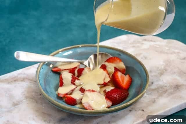 Crème Anglaise: Classic French Vanilla Custard Sauce Recipe 7 Crème anglaise poured over fruit.