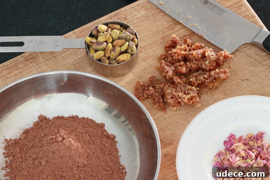 How to Make Rich Homemade Dark Chocolate from Scratch 3 Cocoa powder, pistachios, minced dates, and rose petals