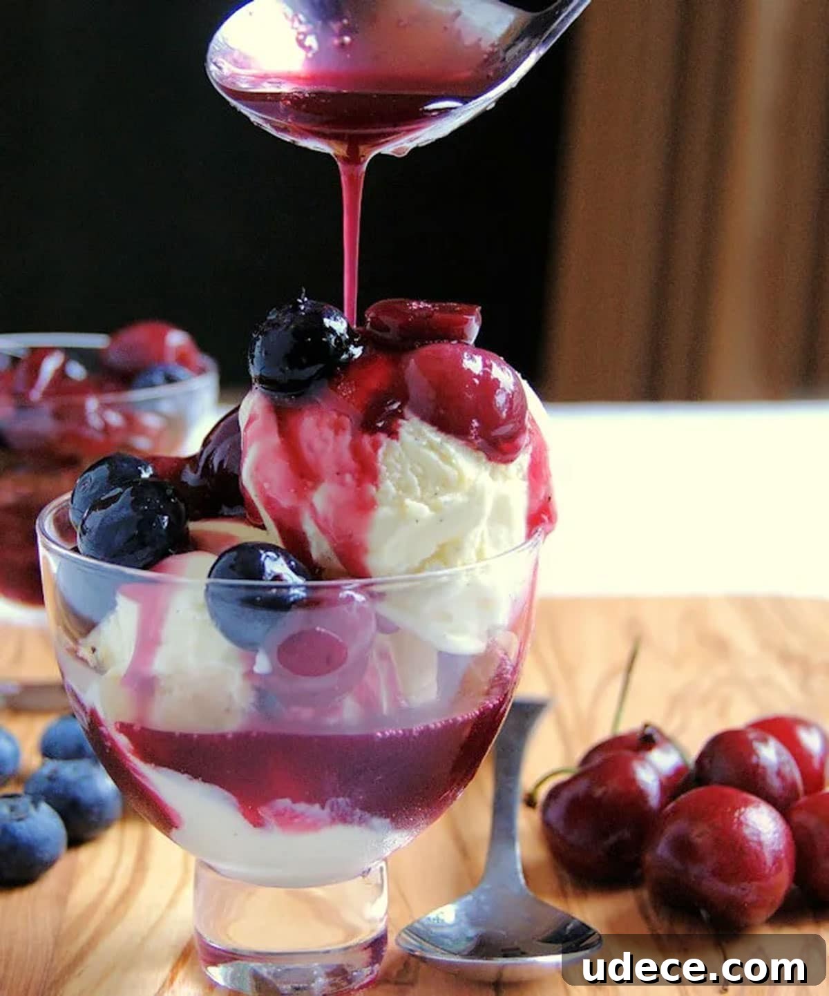 Vanilla ice cream topped with blueberry and cherry compote.