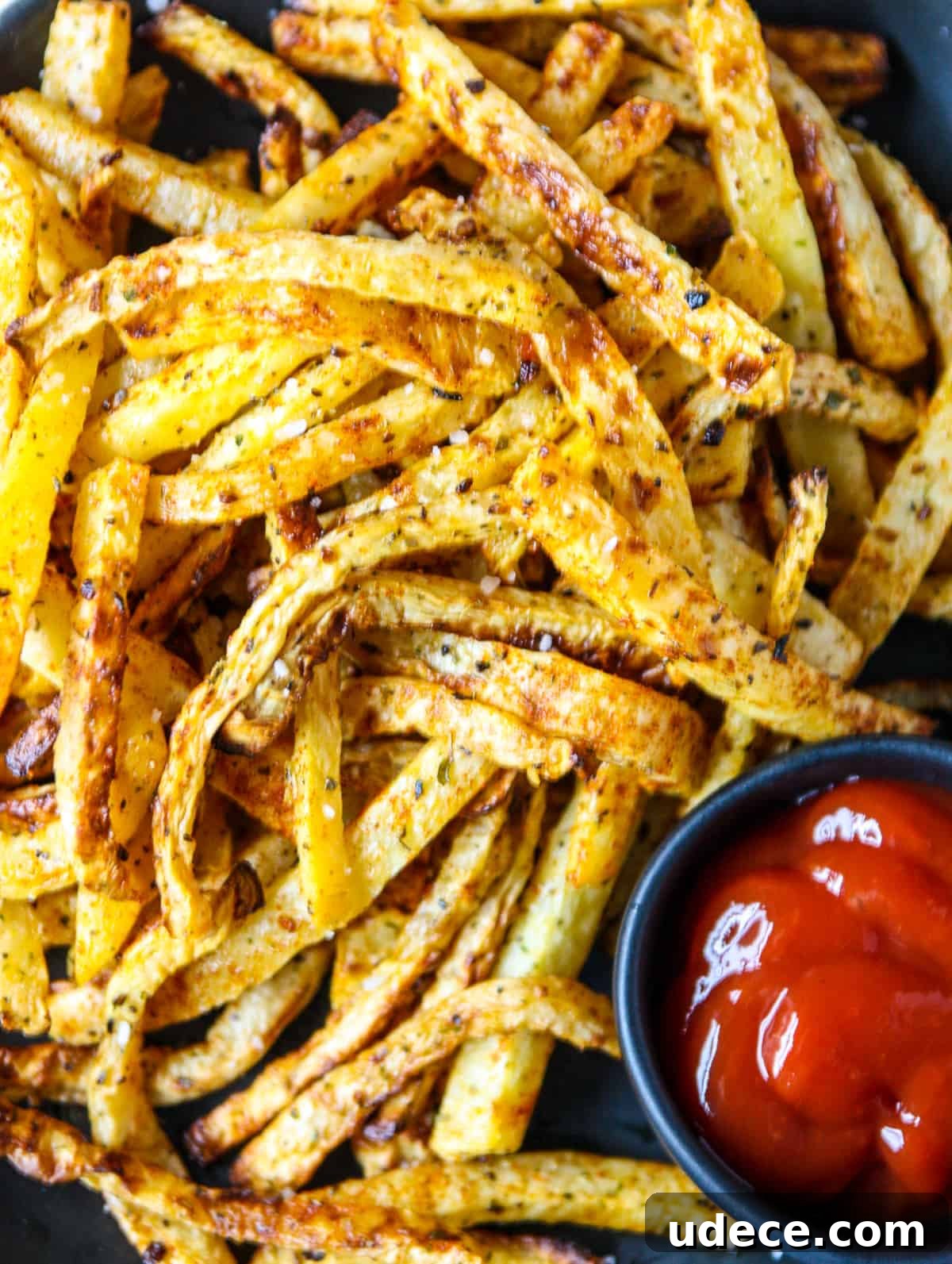 Crispy Air Fryer Rutabaga Fries with Garlic Parmesan Dip 3 A close up of a pile of air fryer rutabaga fries.
