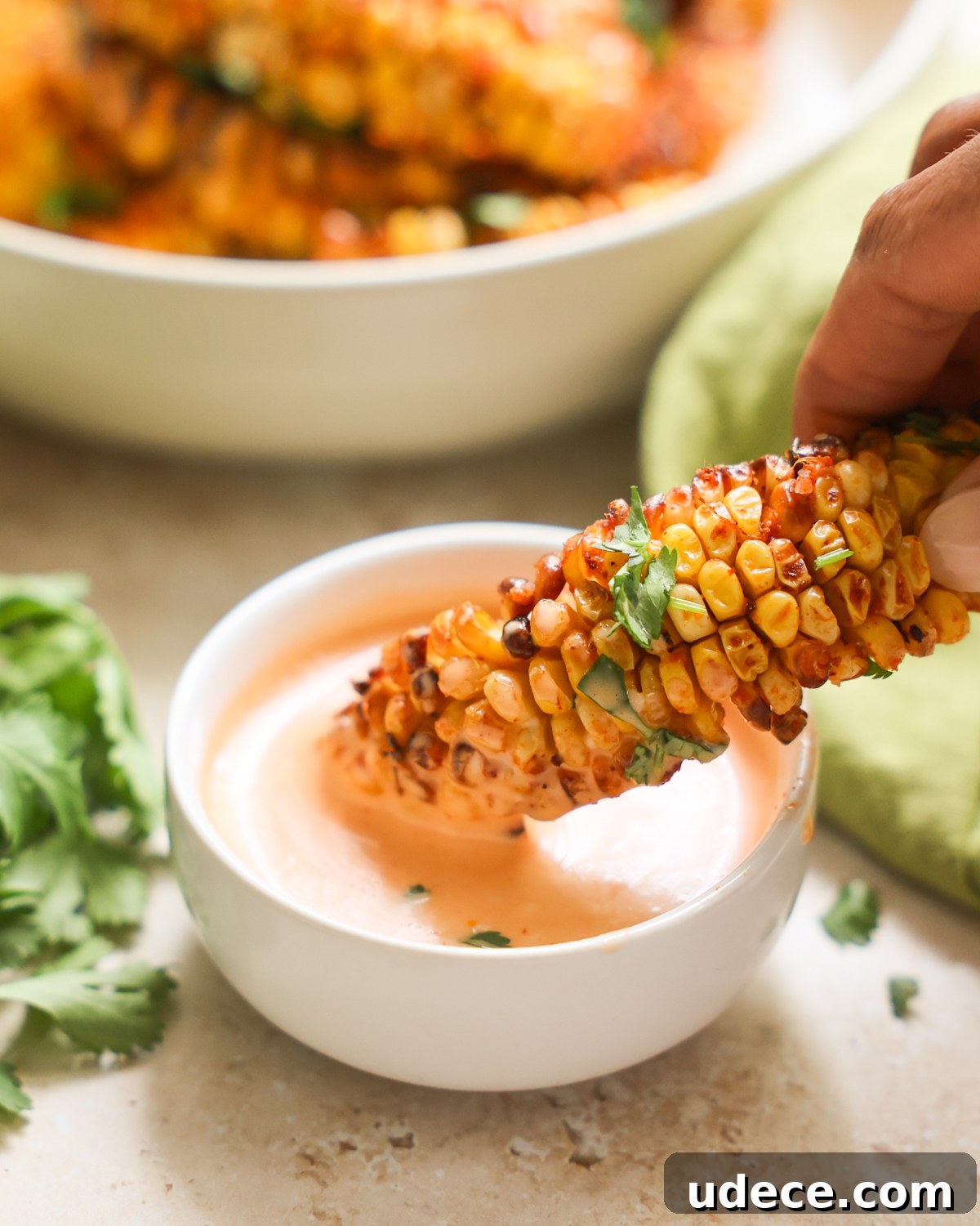 Crispy Corn Ribs Recipe: Tangy BBQ Flavor for Summer Cookouts 3 dipping corn ribs in aioli