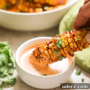 Crispy Corn Ribs Recipe: Tangy BBQ Flavor for Summer Cookouts 11 dipping corn ribs in aioli