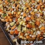 Roasted Winter Vegetables with Cannellini Beans- roasting these vegetables makes them over-the-top delicious! The veggie-hating guys in my house couldn't stop eating them!